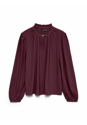 Blusa burdeos con mangas largas abullonadas, un escote con volantes, apertura en forma de ojal y un botón con acento dorado. Tejido suave y corte suelto.