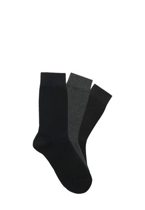 Drei Paar Socken in einfarbigen Farben: ein dunkles Marineblau, ein anthrazitgrau und ein schwarz. Sie haben ein typisches Crew-Längen-Design.