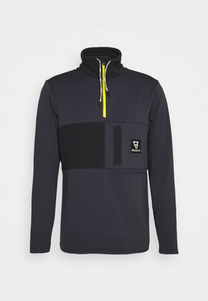 Schwarzer Herren-Pullover mit Viertel-Reißverschluss und hohem Kragen, gelbem Reißverschluss, Brusttasche und kontrastierendem Stoffeinsatz über der Brust.