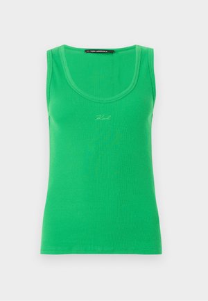 Débardeur sans manches vert à côtes avec encolure dégagée et petite signature « Karl » brodée au centre devant.