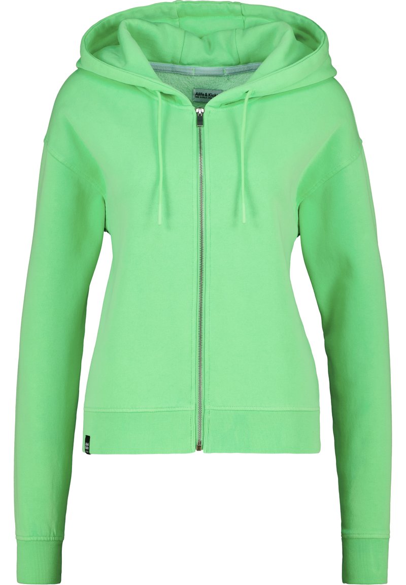 Haut en molleton vert à fermeture éclair avec une capuche doublée, des cordons de serrage et des poignets côtelés. Il présente une texture douce et une coupe légèrement courte.