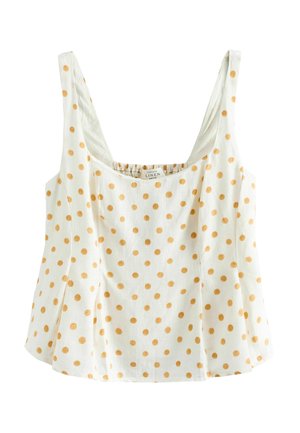 Hvid ærmeløs hørtop med brede stropper og orange polkaprikker, med firkantet halsudskæring og udvidet underkant.