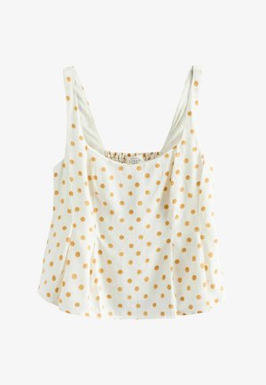 Hvid ærmeløs hørtop med brede stropper og orange polkaprikker, med firkantet halsudskæring og udvidet underkant.