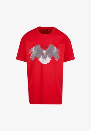 Red cotton t-shirt featuring a large graphic of eagle wings in gray on the front, with three black stars above and text underneath.