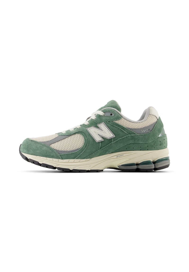 Green and beige athletic shoe featuring a suede and mesh upper, with a cushioned sole, prominent branding, and grey accents.