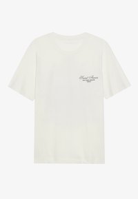 White cotton t-shirt with a round neckline and short sleeves, featuring black text detailing on the left chest. Soft texture and casual fit.
