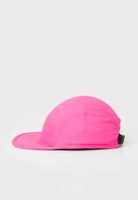 Pink cap with a curved brim, lightweight material, structured shape, and adjustable strap at the back. Smooth texture with no visible patterns.