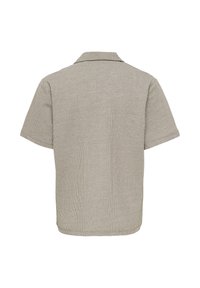Polo en maille beige à manches courtes avec une texture côtelée, vu de dos sur fond blanc.