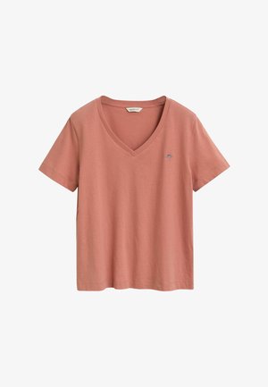 Roze v-hals t-shirt van katoen. Korte mouwen, losse pasvorm en klein logo op de linkerkant van de borst. Soepele textuur, geen patronen.