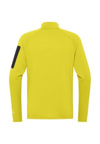 Maglietta sportiva a manica lunga di colore giallo brillante con tessuto testurizzato. Presenta un accento nero sulla manica sinistra e un design con colletto alto.