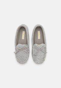 Gray woven slippers with a soft interior, rounded toe, and decorative gray bow. Features a textured mesh design and plush lining.