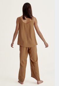 Born Living Yoga Tygbyxor - brown