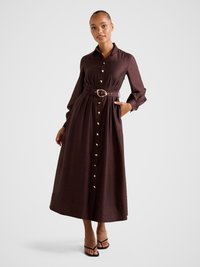 Long brown button-up dress with a belt, featuring long sleeves, a collar, and golden buttons running down the front. Smooth fabric texture.