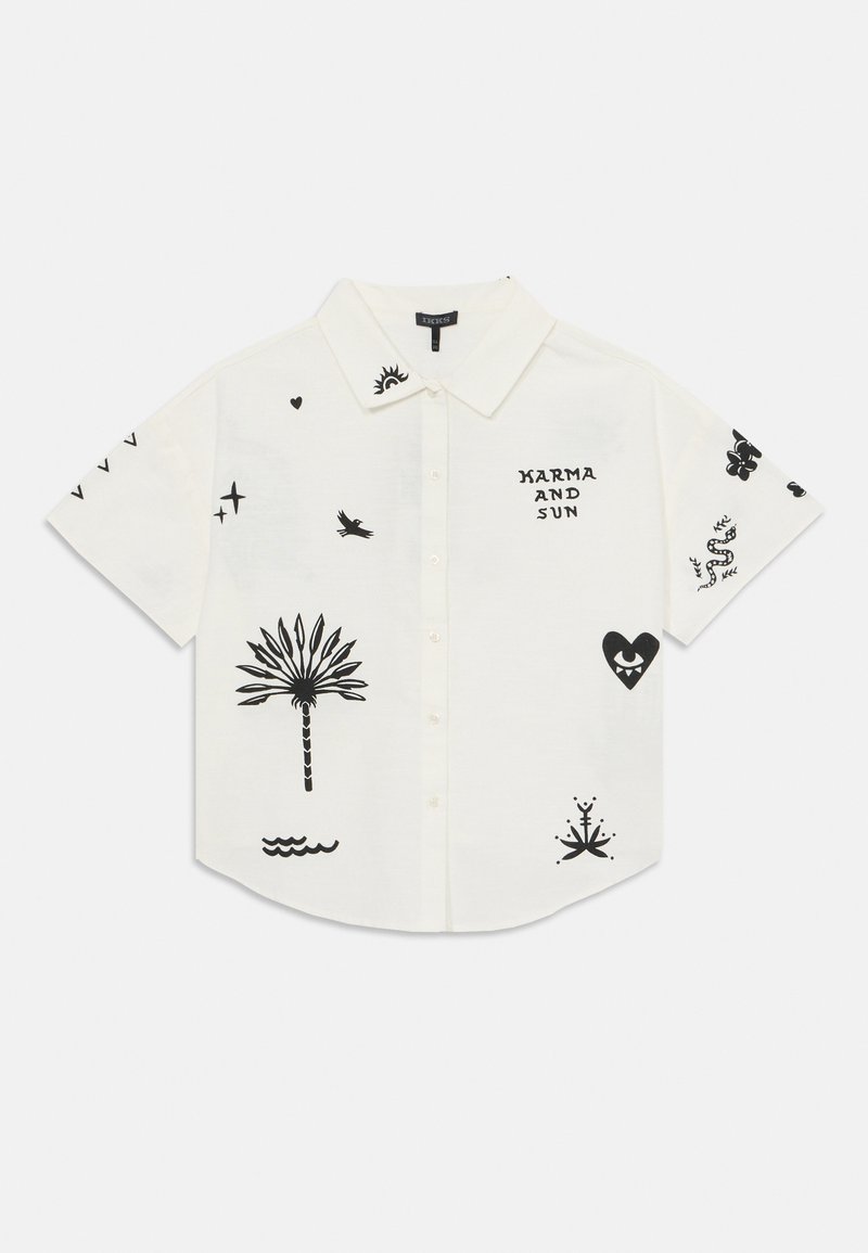 Kortsleeve hvit skjorte med knapper og svarte grafiske trykk, inkludert palmer, sol og hjerte motiver. Myk bomullsstoff, avslappet passform.