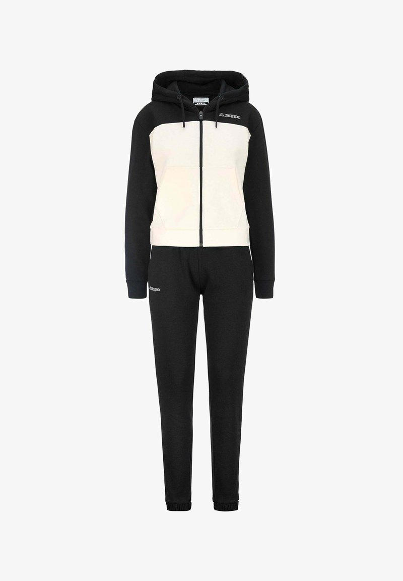 Tuta nero e crema con felpa con zip e polsini elasticizzati, caratterizzata da un design a pannelli contrastanti e un logo sul davanti.