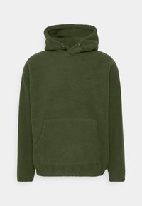 Felpa con cappuccio verde in pile con coulisse, tasca a marsupio e polsini a coste. Caratterizzata da tessuto morbido e testurizzato e marchio discreto.