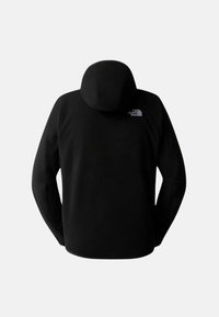 Felpa nera in pile con cappuccio fitted, maniche raglan e un piccolo logo bianco sulla parte superiore della schiena. Texture morbida, design minimale.