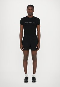 Ludovic de Saint Sernin SIMPLE SHORT SLEEVES STUD LOGO UNISEX - Print T-shirt - black