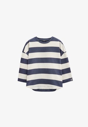 Pasiasty, długi rękaw, top w granatowo-kremowym kolorze z mieszanki bawełny. Charakteryzuje się okrągłym dekoltem i zaokrąglonym dołem z małym detalem logo.