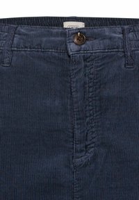 Blaue Cordhosen mit vertikalen Streifen, einem Knopfverschluss und gestickten Details an der Taille und den Taschen.