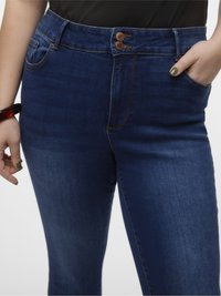 Dark blue denim jeans with a high waist, featuring a double button closure, five pockets, and visible stitching details. Smooth texture.