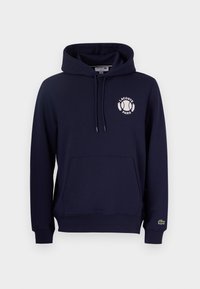 Námořnická mikina s klokanní kapsou, kapucí se šňůrkou a bílým potiskem loga s tenisovým míčkem a "LACOSTE PARIS." Volný střih.