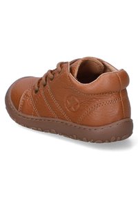 Brown leather shoe with rounded toe, lace-up design, textured surface, and a rubber sole featuring a wave pattern.