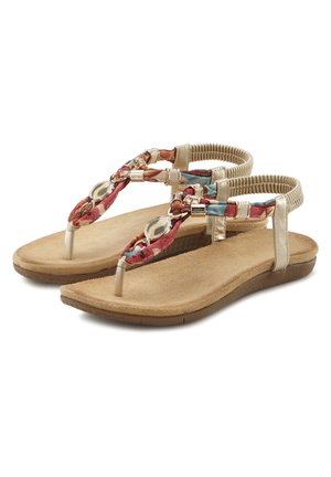 Flat thong sandals with a beige synthetic strap, braided multicolored textile design, and gold accents. Cushioned, textured footbed.