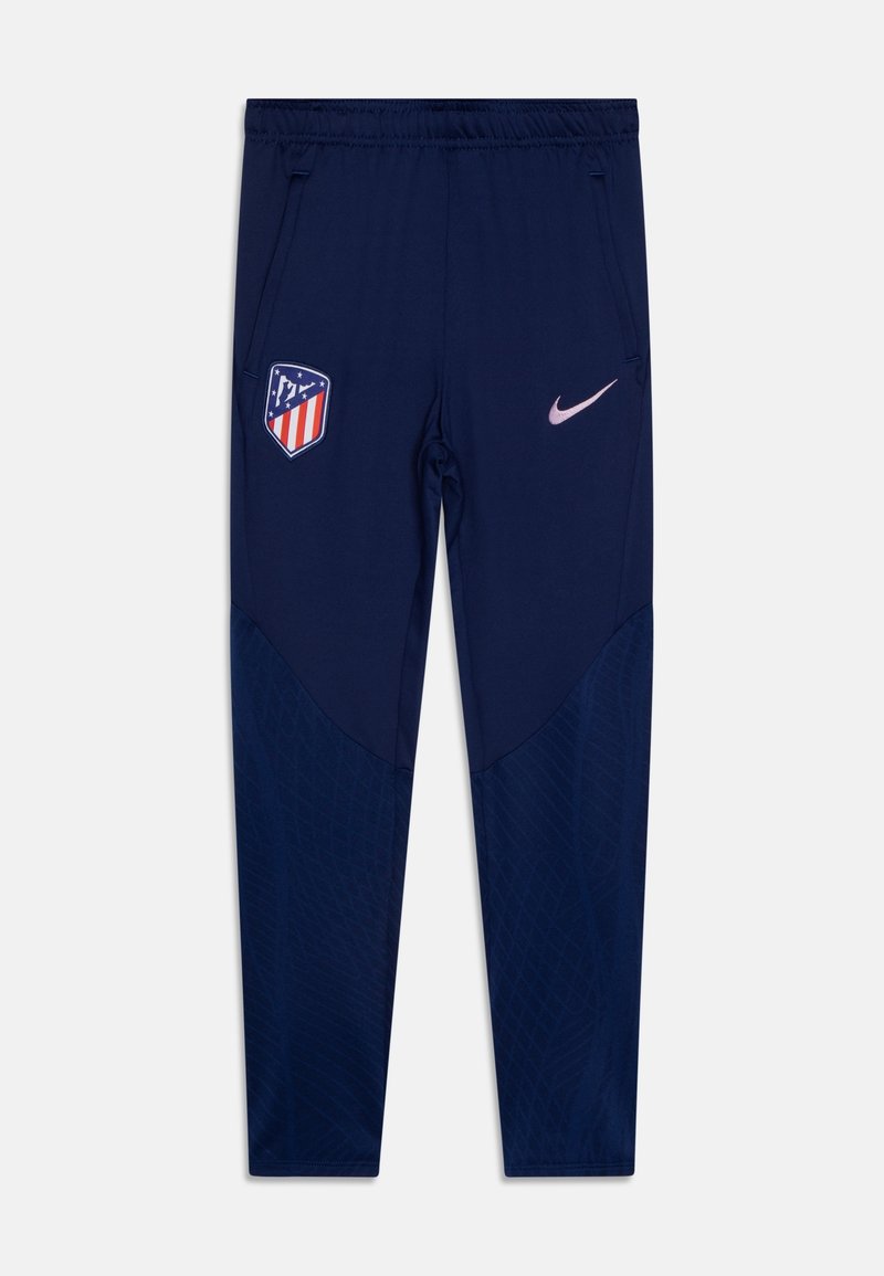 Dunkelblaue Sporthose mit elastischem Bund, Atlético Madrid-Logo auf dem linken Oberschenkel und hellrosanem Nike-Swoosh auf dem rechten Oberschenkel.