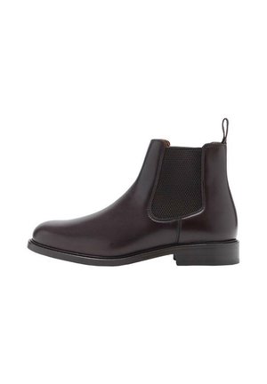 Botte Chelsea en cuir marron foncé avec un panneau latéral élastique et un tirant, talon bas et bout arrondi, vue de profil.