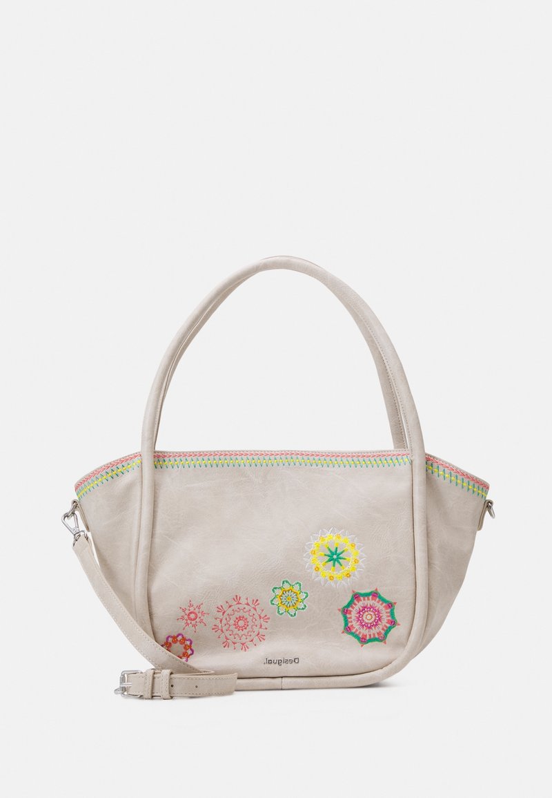 Beige læder håndtaske med to håndtag og en justerbar rem, med farverig blomsterbroderi og dekorativ syning langs lynlåsen.
