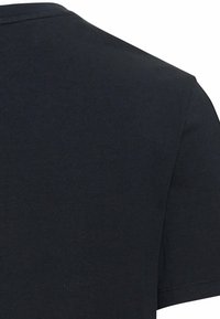 Sort bomulds T-shirt med rund hals og korte ærmer. Stoffet ser glat ud med minimale sømme og en klassisk pasform.