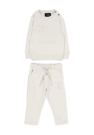 Felpa per bambini color crema con motivo geometrico in rilievo e pantaloni coordinati con coulisse, tasche laterali e vita elastica.