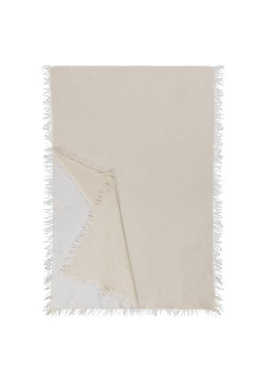 Texturiertes Decke in sanftem Cremeton mit Fransen; eine Seite glatt, die andere leicht flauschig. Wendbares Design.
