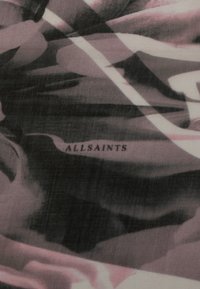 Black and pink abstract patterned fabric featuring the text "ALLSAINTS" in a subtle print. Soft texture with a flowy appearance.