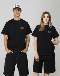 Black cotton t-shirts with short sleeves, featuring a colorful logo on the left chest. Both wear black denim shorts with pockets.