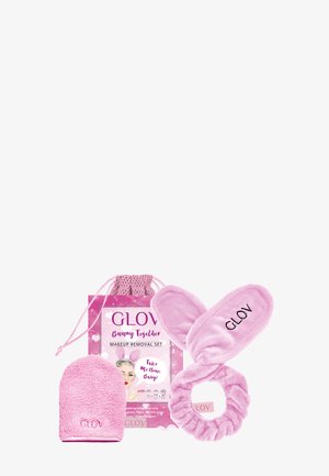 Pinkes GLOV Make-up-Entfernungsset mit Mikrofaser-Fäustling, Stirnband mit Hasenohren und rosafarbenem Beutel mit Kordelzug.