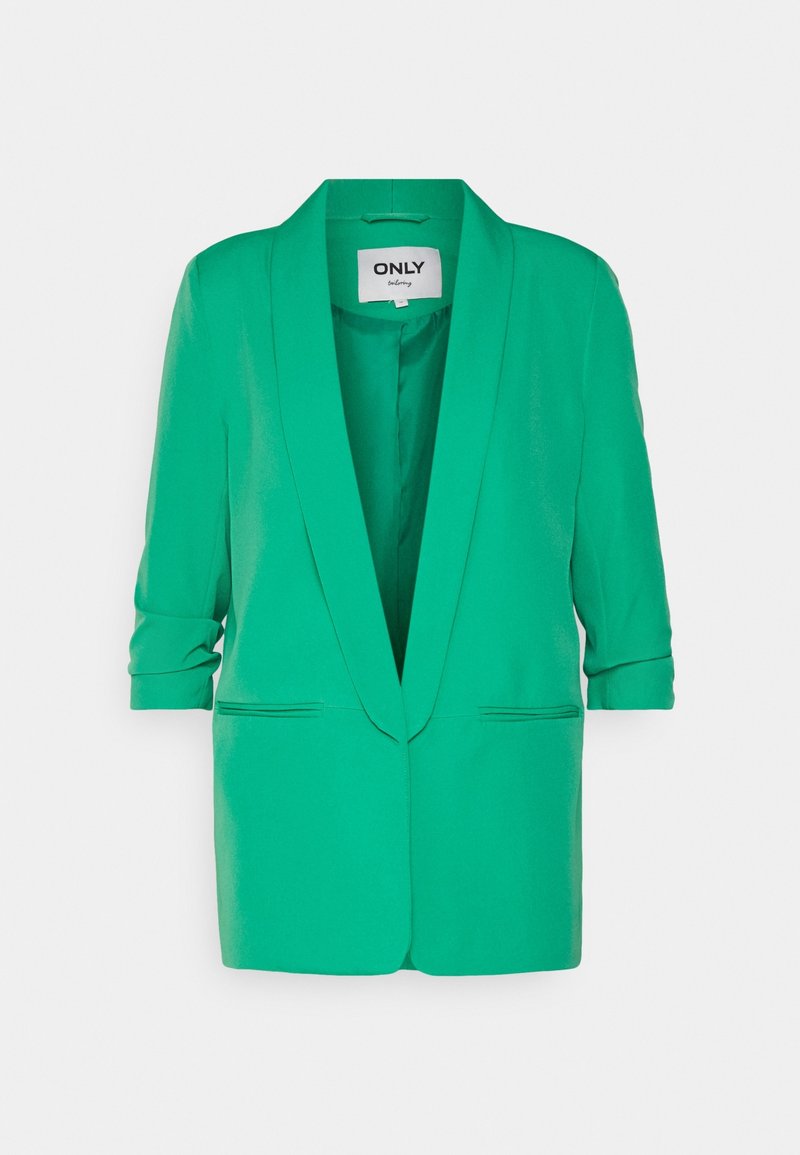 Veste verte pour femmes avec manches retroussées, col cranté et deux poches fendues à l'avant. Étiquette "ONLY tailoring" à l'intérieur du col.