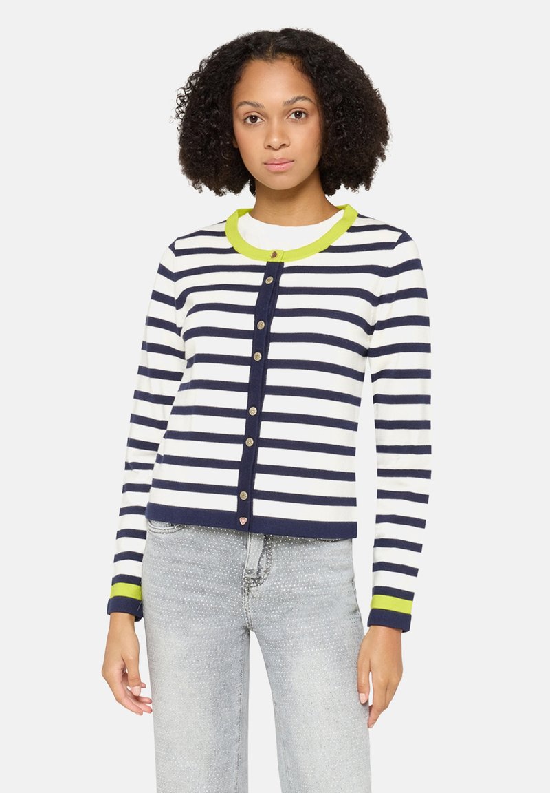 Granatowo-biały kardigan w paski z zielonym kołnierzem, zapięciem na guziki i długimi rękawami. Miękka tkanina z prążkowanymi mankietami i dołem.