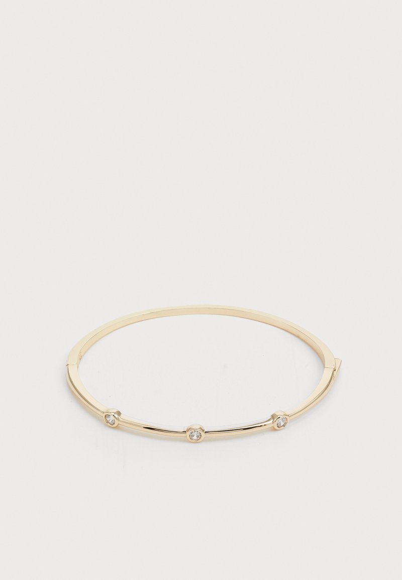 Gold-tone metal bangle bracelet featuring three small clear faceted stones, round shape, smooth texture, and minimalistic design.
