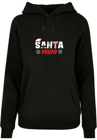 Svart hettegenser med "SANTA SQUAD" grafikk i rødt og hvitt, med snøfnugg. Laget av mykt stoff med en frontlomme.