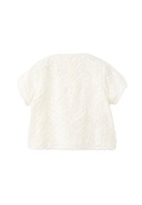 Maglietta bianca a maniche corte con una superficie testurizzata e morbida. Il retro presenta una fila di piccoli bottoni. Design ampio con un orlo arrotondato.