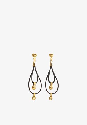 Pendientes de botón en tono dorado con doble aro negro colgante, cada aro presenta un pequeño acento dorado de forma irregular.