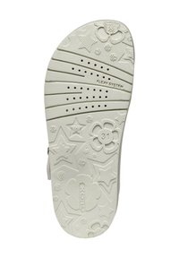 Suola di scarpa in gomma bianca con motivi in rilievo di fiori e stelle, zone testurizzate e fori di ventilazione. Marcata con "FLEXI SYSTEM."