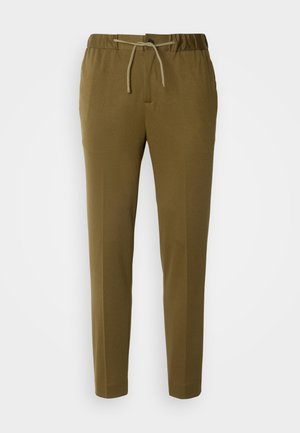 Trousers in olive green, elastic waistband with drawstring, tapered leg design, textured fabric, streamlined shape with no visible pockets.