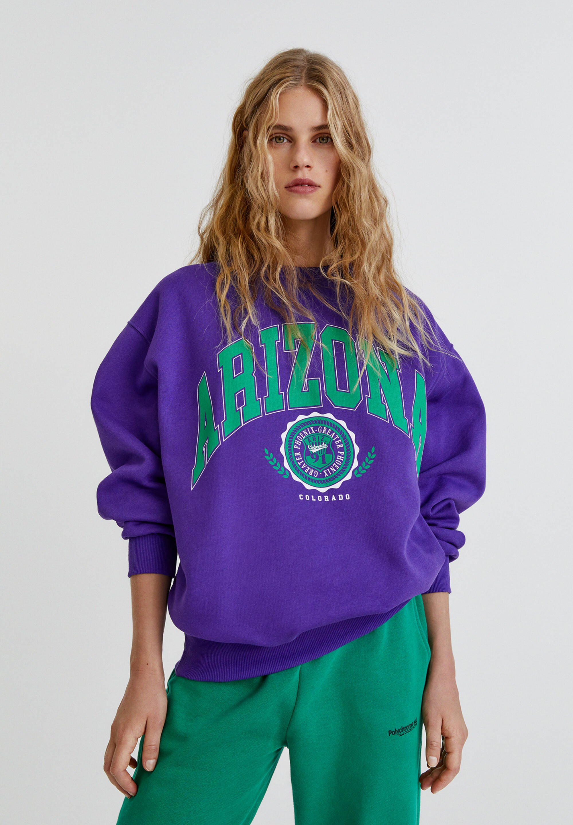 purple graphic sweater