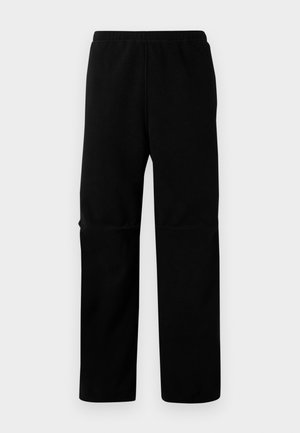 Pantalones de forró negros con cintura elástica y diseño de pierna recta. Textura suave sin patrones o elementos metálicos visibles.