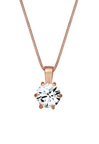 Collier en chaîne en or rose avec un pendentif en forme de rond, orné d'une pierre précieuse transparente et façonnée, maintenue par six griffes. Texture lisse avec une finition polie.