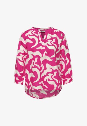 Różowa bluzka z długim rękawem z abstrakcyjnymi białymi wirującymi wzorami, rozcięciem w kształcie litery V i zaokrąglonym dołem.