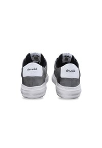 Gray suede sneakers with white leather heel accents, featuring a cushioned collar and rubber outsole. Branding on the heel and tongue.